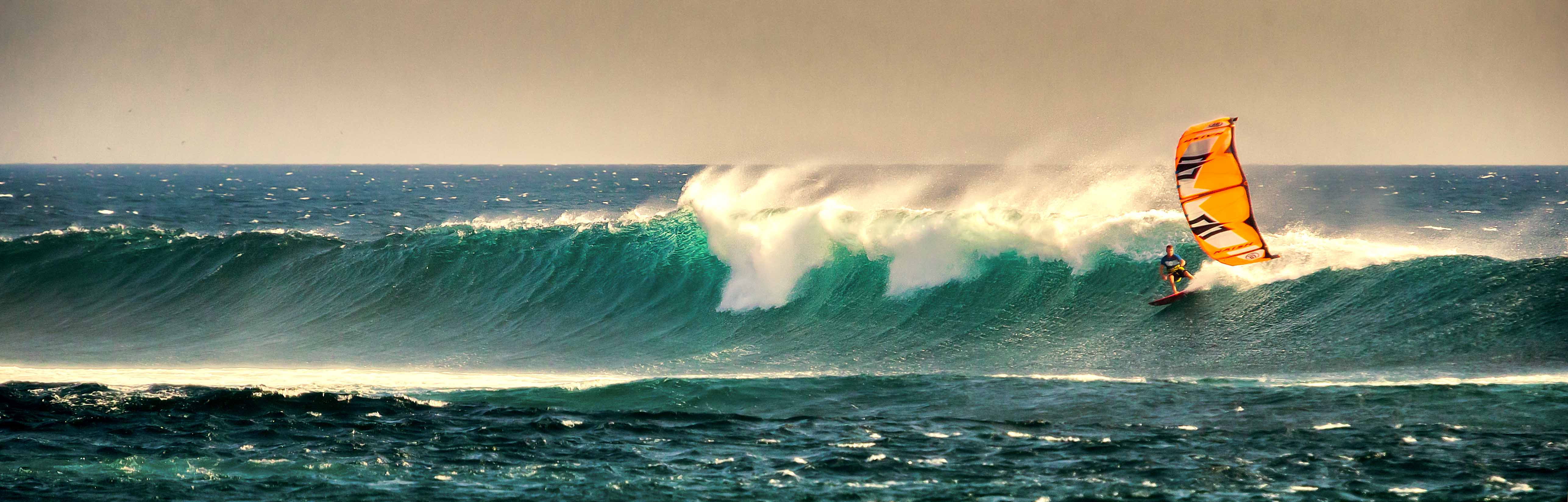 Kevin Langeree rides wave in Indonesia.jpg